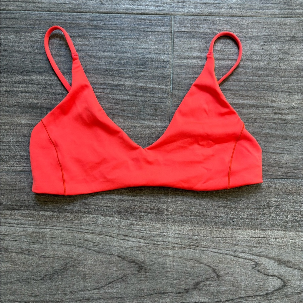 Left on Friday Sunday swim top size medium color Aperol (neon orange)